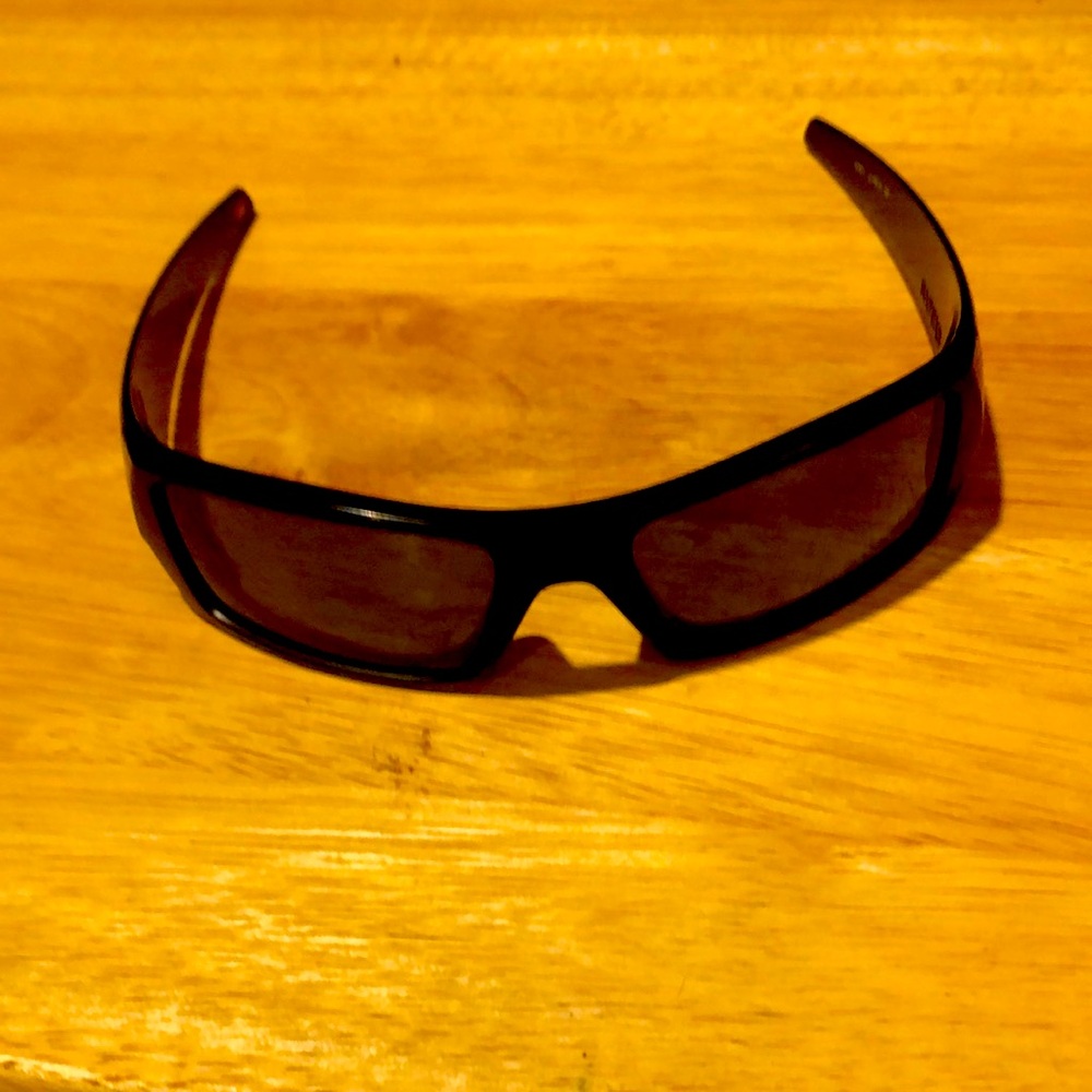Oakley gas can style sunglasses in black frame with grey lense